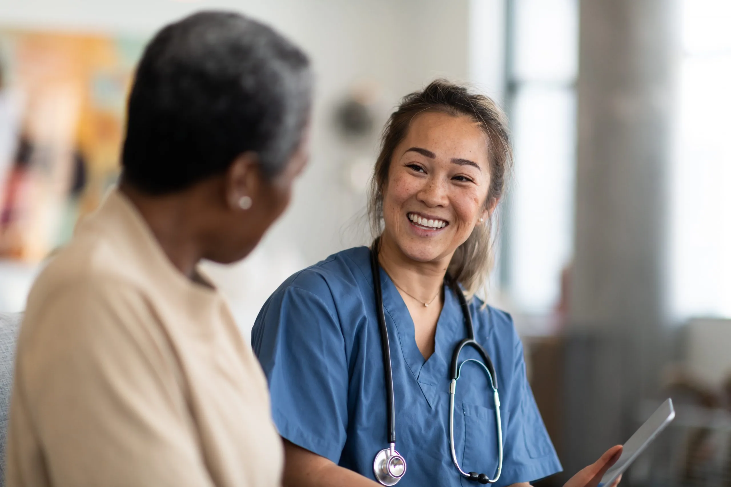 Heart specialist consulting with a patient about atrial fibrillation treatment