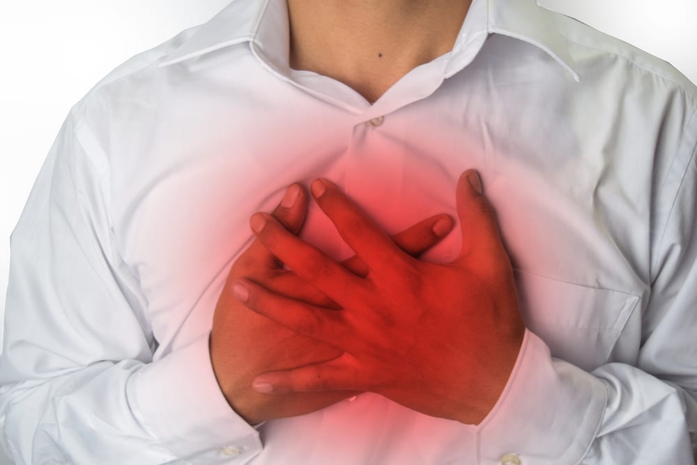 Person with chest discomfort that may be heartburn or a heart problem
